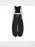 PUKI Lace Waistband Curved Leg Pants in Black - On Model