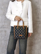WANLIMA Leather Trimmed Monogram Denim Tote in Denim - On Female Model