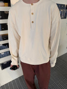 TRIANGLE PROJECT Ribbed Cotton Henley Sweatshirt in White - On Model