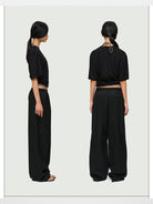 RARELY ALIKE Asymmetrical Ruched Waist Tee in Black - On Model
