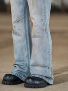 BLINDNOPLAN Distressed Ink Splatter Flare Jeans in Blue - On Model