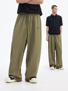 MEDM Cooling Wide Leg Track Pants in Olive - On Male Model
