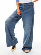 Alright Then Mid Rise Wide Leg Jeans in Blue - On Model