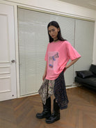 NeverSeez Hazy Puppy Print Cotton T Shirt in Pink - On Female Model