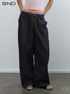RARELY ALIKE Drawstring Wide Leg Raw Denim Jeans in Blue - On Model