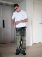 UNKNOWNWORLD Small Logo Cotton T Shirt in White - On Model