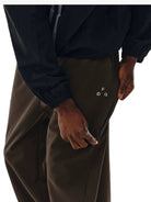 FPA Fleece Lined Soft Shell Pants in Brown - On Model