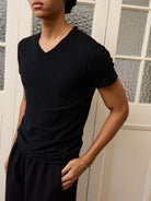 Retro 21 Anti Wrinkle V Neck T Shirt in Black - On Model