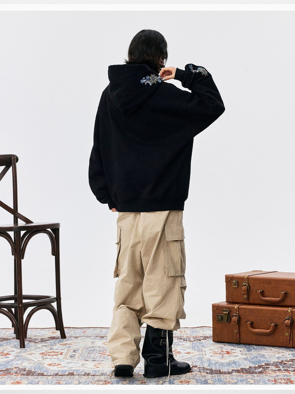 MEDM Floral Embroidered Fleece Hoodie in Black - On Male Model