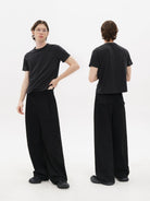 MasonPrince Pleated Wide Leg Suit Trousers in Black - On Model