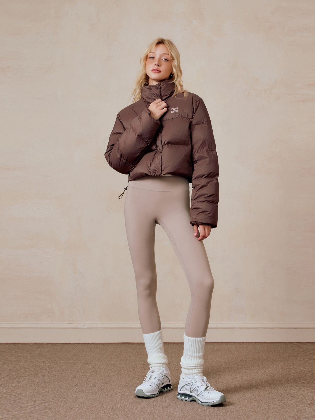 PUKI Cropped White Duck Down Puffer in Brown - On Model
