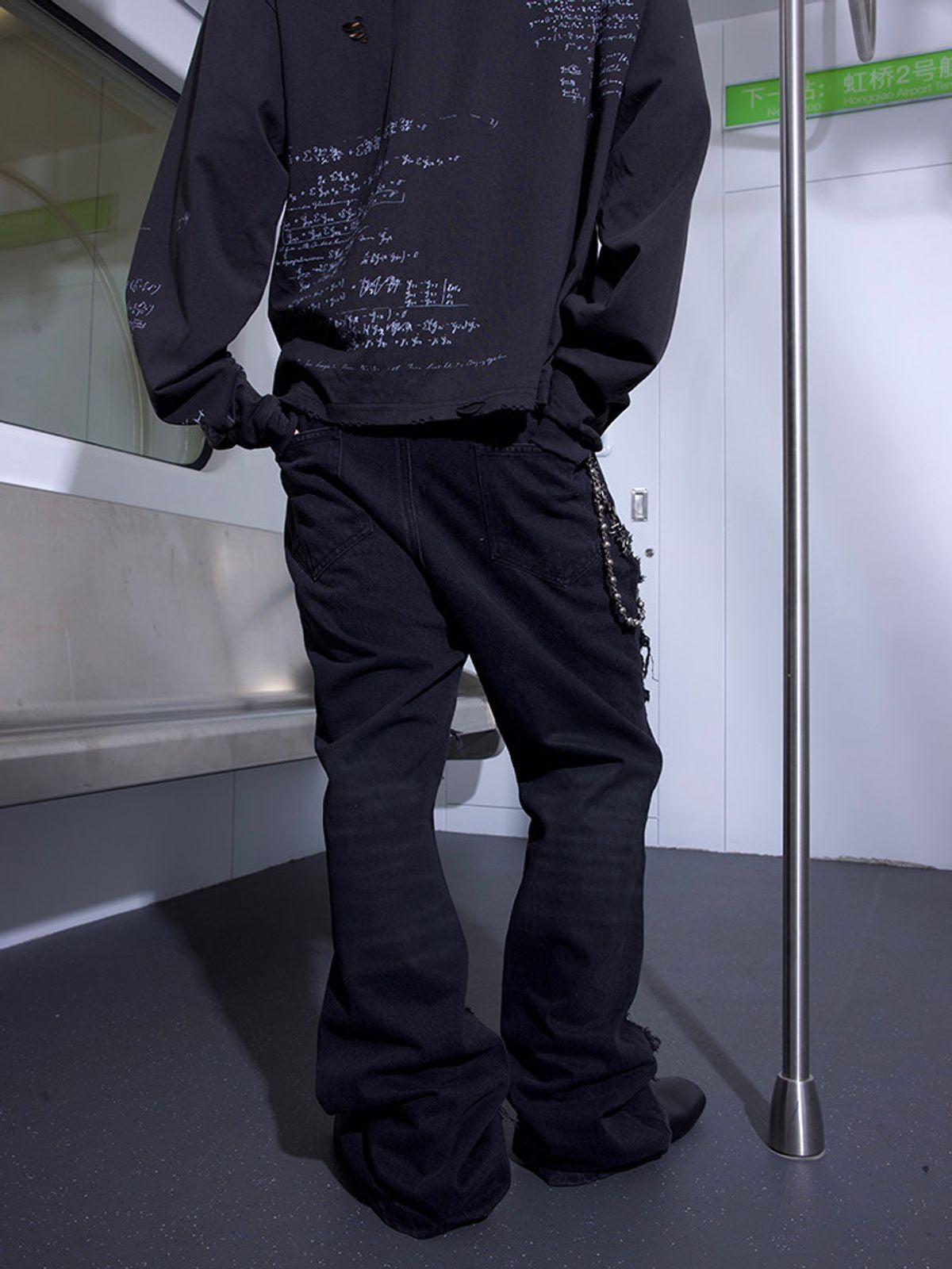 TRIANGLE PROJECT Deconstructed Patchwork Micro Flare Jeans in Black - On Model