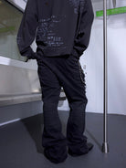 TRIANGLE PROJECT Deconstructed Patchwork Micro Flare Jeans in Black - On Model