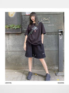LOSTCTRL Raw Edge Embroidered Cotton Shorts in Black - On Female Model