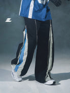 LOSTCTRL Deconstructed Zip Split Pants in Black - On Model