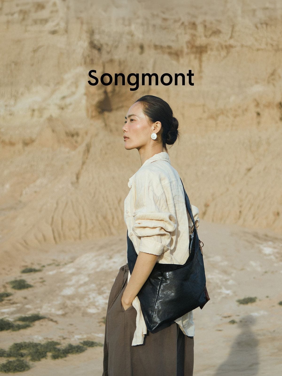 Songmont Broken Shell Leather Crossbody Hobo in Black - On Model