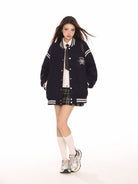 BIGGOLD STUDIO Retro Stand Collar Varsity Jacket in Navy Blue - On Model #color_navy-blue