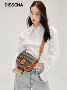 DISSONA Monogram Crossbody Saddle Bag in Brown - On Female Model