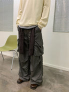 NeverSeez Spliced Wide Leg Cargo Pants in Green - On Male Model