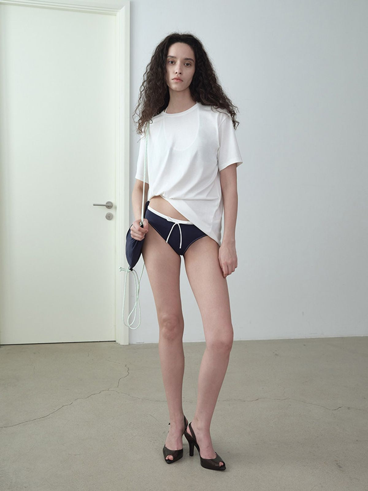 RARELY ALIKE Twisted Hem Cotton Silk Blend Tee in White - On Model