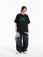 LOSTCTRL Cross Stitch Graphic Tee in Black - On Male Model