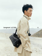 Songmont Soft Leather Pillow Camera Bag in Black - On Model