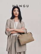HONGU Leather Commuter Top Handle Bag in Beige - On Female Model