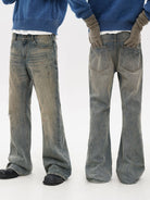 MASONPRINCE Distressed Boot Cut Washed Jeans in Blue - On Model #color_blue