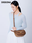 DISSONA Leather Crossbody Saddle Bag in Beige - On Female Model
