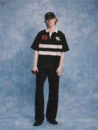 SOD Distressed Embroidered Rugby Polo in Black - On Model