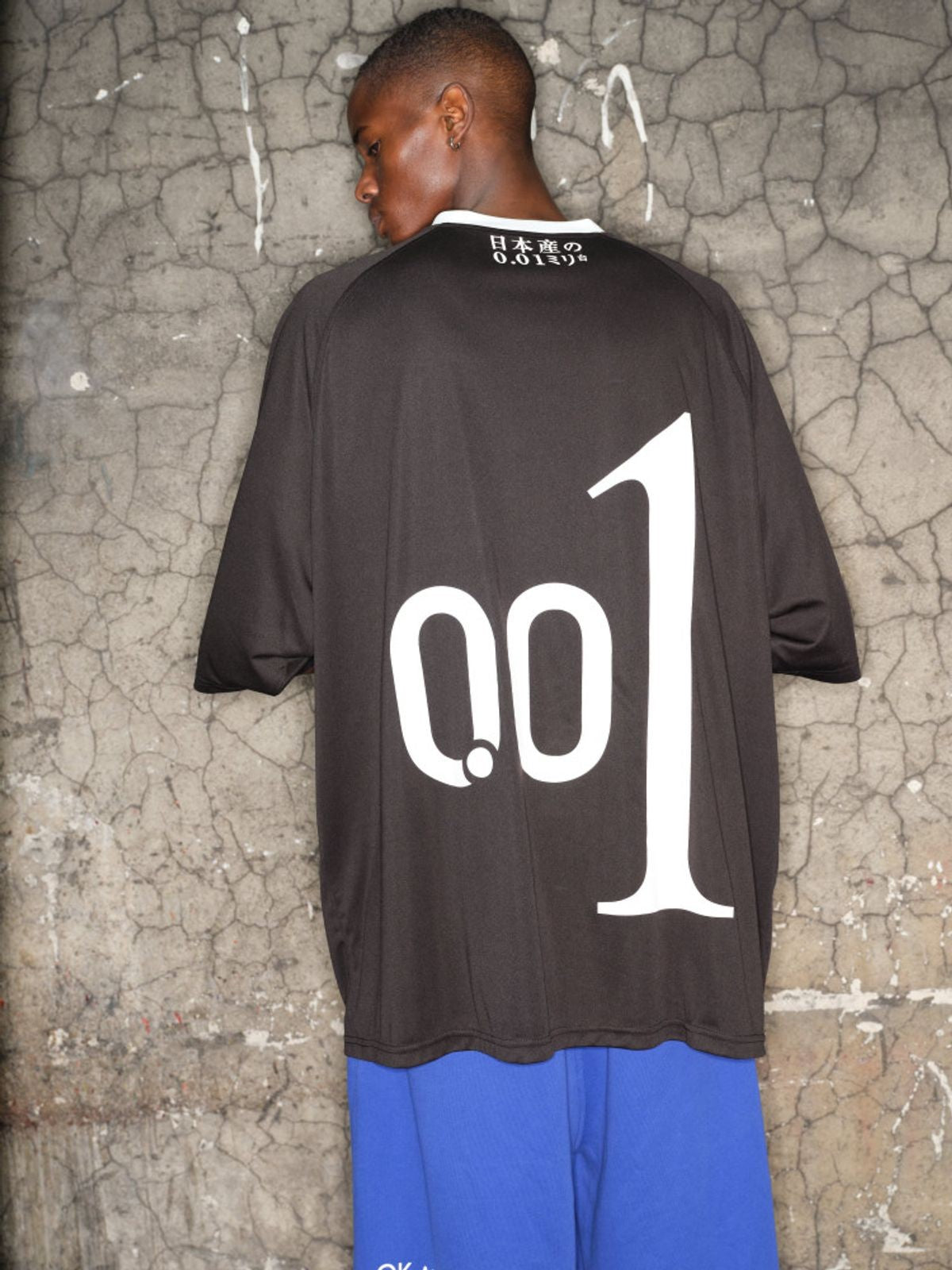 TRIANGLE PROJECT 001 Graphic V Neck Jersey Tee in Black - On Model