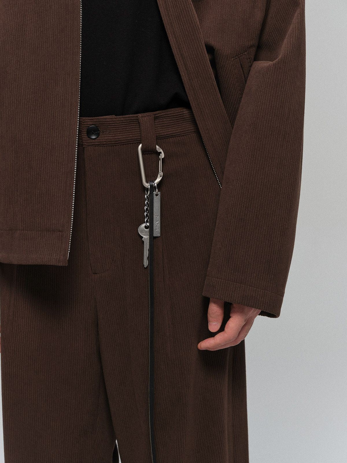 NANS Single Pleat Corduroy Micro Flare Trousers in Brown - Detail