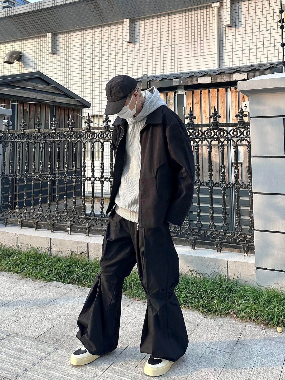 TRIANGLE PROJECT Deconstructed Origami Flare Pants in Black - On Model