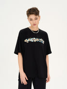 LOSTCTRL Camellia Graphic Print T Shirt in Black - On Female Model