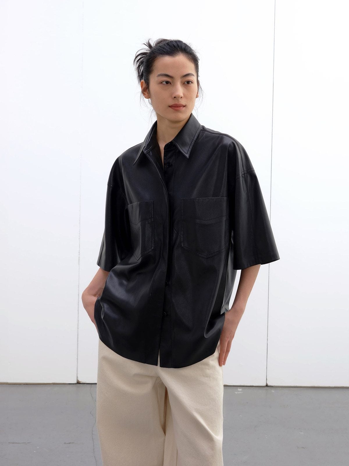 Randompiece Matte PU Leather Short Sleeve Shirt Jacket in Black - On Model