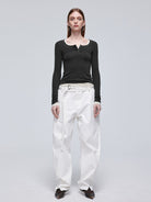 Simple Project Twisted Belt Curved Leg Pants in White - On Female Model