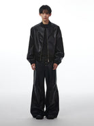 THELIGHT OFFICIAL Buckled Faux Leather Varsity Jacket in Black - On Model