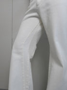 RARELY ALIKE Flared Cotton Denim Jeans in White - Detail