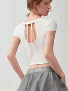 PUKI Open Back Bow Detail T Shirt in White - On Model