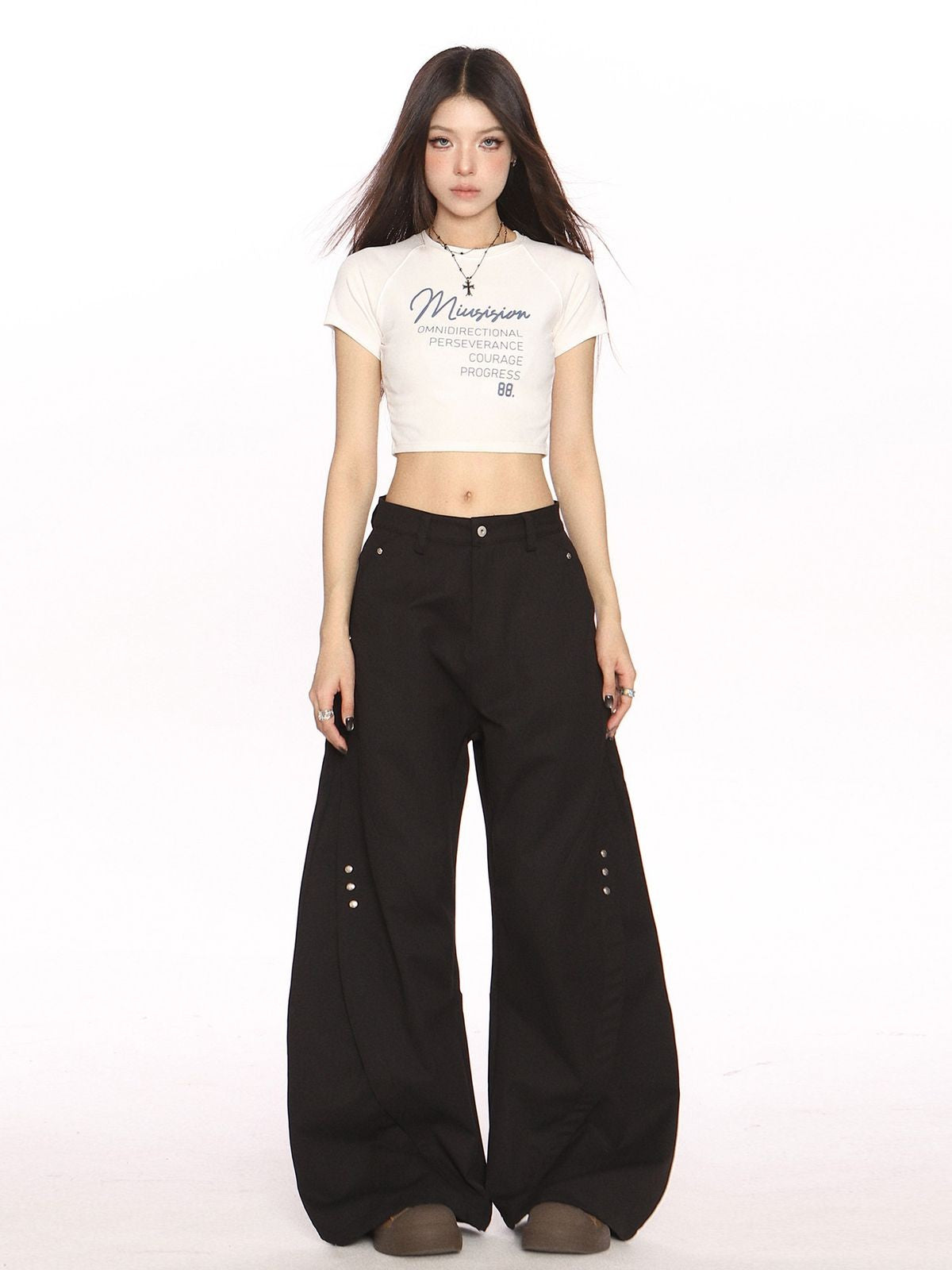 BIGGOLD STUDIO Deconstructed Curved Seam Trousers in Black - On Model #color_black