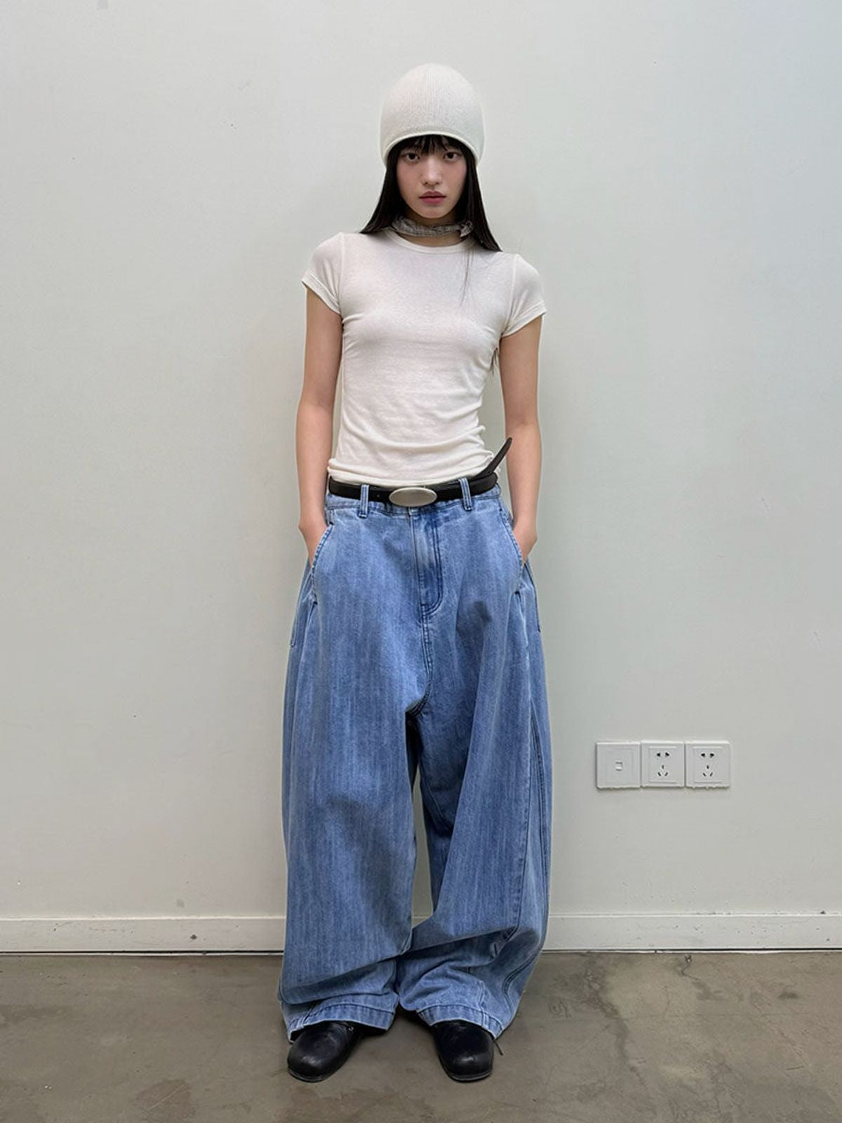 NeverSeez Curved Leg Dirty Wash Jeans in Blue - On Model