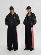 MasonPrince Hooded Racing Patch Puffer in Black - On Model