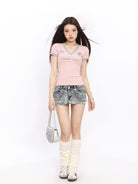 BIGGOLD STUDIO Contrast Trim V Neck Jersey Tee in Pink - On Model #color_pink