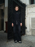 TRIANGLE PROJECT Logo High Neck Long Sleeve Top in Black - On Model