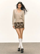 ARISEISM Cropped V Neck Cardigan Neck Tie in Beige - On Model