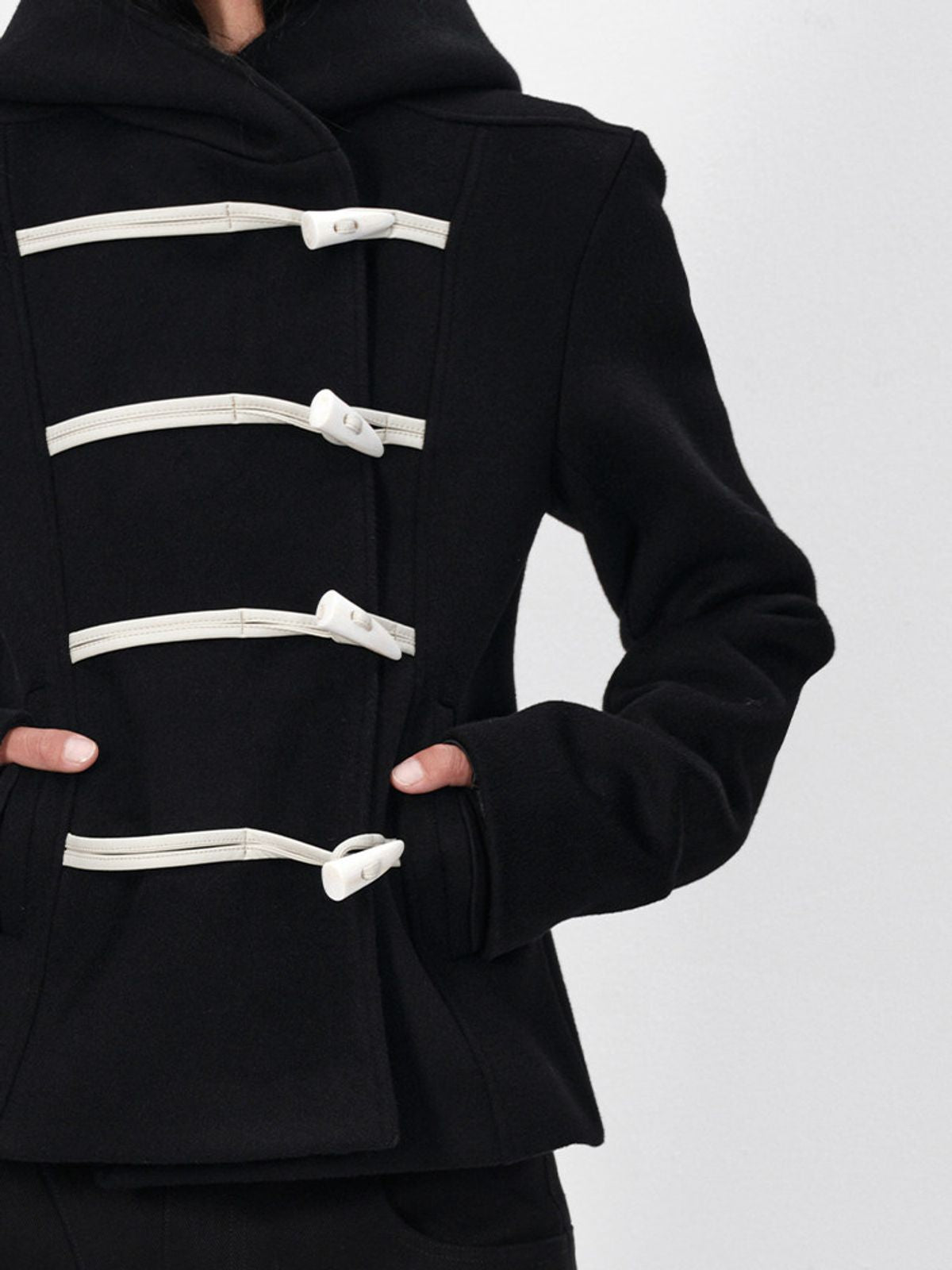 RARELY ALIKE Hooded Lamb Wool Toggle Coat in Black - On Model