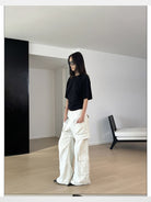 RARELY ALIKE Asymmetrical Ruched Waist Tee in Black - On Model