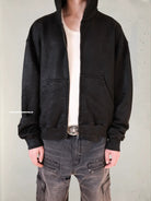 UNKNOWNWORLD Hand Waxed Cotton Zip Up Hoodie in Black - On Model