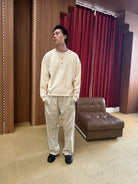 TRIANGLE PROJECT Ribbed Cotton Henley Sweatshirt in White - On Model