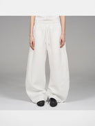 Blindnoplan Heavyweight Curved Leg Sweatpants in White - On Model